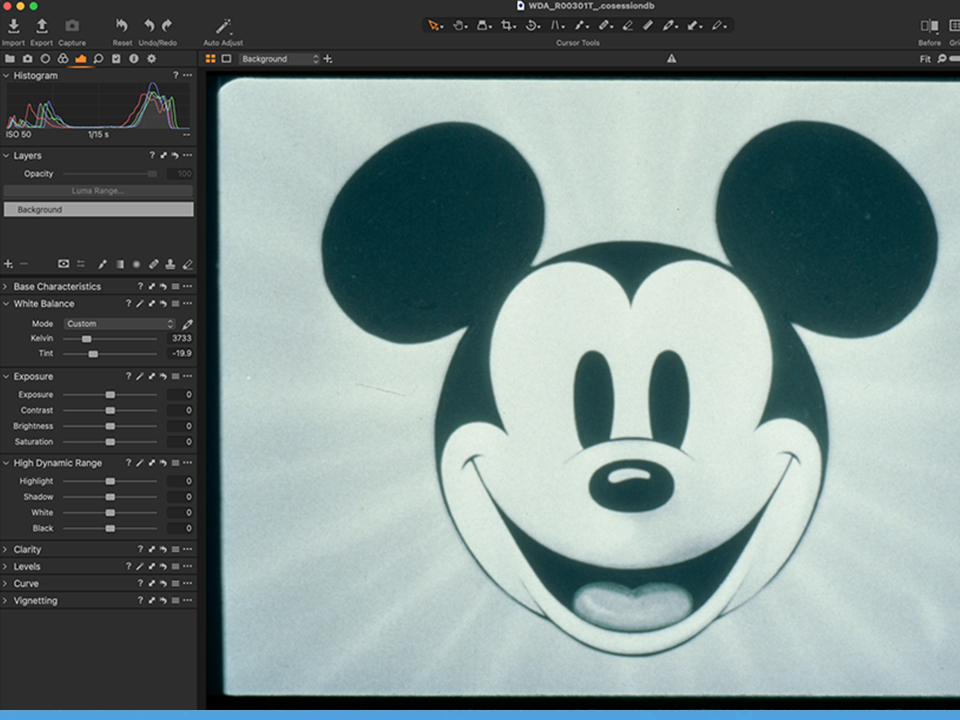 Studio production material being digitized and tagged with searchable metadata for archival reuse.